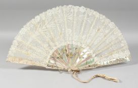 A GOOD VICTORIAN MOTHER OF PEARL AND LACE FAN. 20ins open in a box. Rougier, Paris.