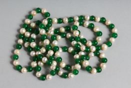 A LONG STRING OF JADE AND PEARL BEADS. 46ins long.