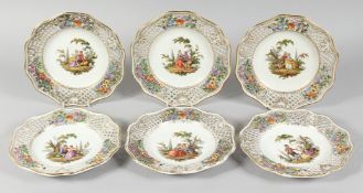 A GOOD SET OF SIX PLATES with pierced borders, the centres painted with figures. 8ins diameter.