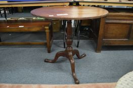 A George III mahogany circular tilt top tripod table.