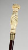 A CARVED BONE HANDLE WALKING STICK 