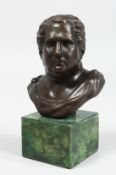AFTER THE ANTIQUE. A BRONZE BUST. 4ins high on a marble plinth.