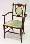 AN EDWARDIAN MAHOGANY INLAID ARMCHAIR with padded back and seat.