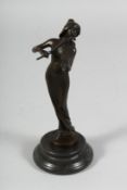 A BRONZE STANDING GIRL playing a violin.