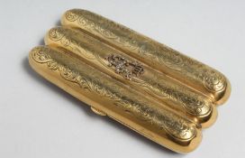 A GOOD RUSSIAN SILVER GILT THREE COMPARTMENT CIGAR HOLDER with engraved decoration. Faberge mark,