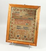 A GEORGIAN SAMPLER in a rosewood frame by ELIZA LUCAS, aged 9 years old. 16ins high,