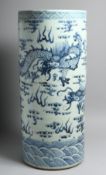 A CHINESE BLUE AND WHITE STICK STAND decorated with dragons. 24ins high.