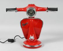 A RED VESPA LAMP.