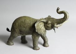 A GOOD AUSTRIAN PAINTED COLD CAST ELEPHANT. 13ins high.