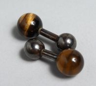 A PAIR OF SILVER AND TIGER'S EYE CUFF STUDS.