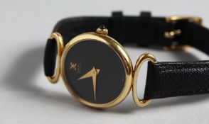 A LADIES YELLOW GOLD EBEL WRISTWATCH AND STRAP in original leather sleeve.