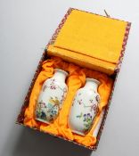 A SMALL PAIR OF CHINESE PORCELAIN VASES painted with birds. 5ins high.