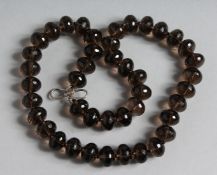 A SMOKEY QUARTZ BEAD NECKLACE.