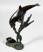 A SMALL ART DECO BRONZE OF A DOLPHIN AND A SHELL. 9.5ins high.