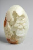 A CHINESE CARVED WHITE JADE PEBBLE. 2.25ins.