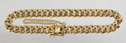AN 18CT GOLD BRACELET.