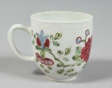 A BOW COFFEE CUP painted in famille rose style with a large chrysanthemum and trailing flowers.