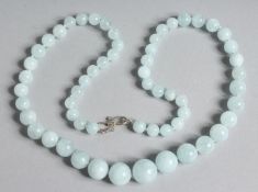 AN AQUAMARINE BEAD NECKLACE. 20ins long.
