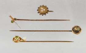 FOUR VARIOUS EDWARDIAN TIE PINS.