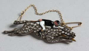 A SUPERB DIAMOND SET AND ENAMEL RACEHORSE AND JOCKEY BROOCH.