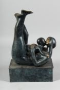 AFTER H. MOORE. A BRONZE MOTHER AND CHILD on a rectangular base. 13ins high.