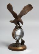 A SMALL EAGLE CLOCK. 8ins diameter.
