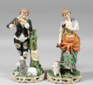 A GOOD PAIR OF SAMSON PORCELAIN CHELSEA DERBY FIGURES a young man playing a flute, a poodle at his