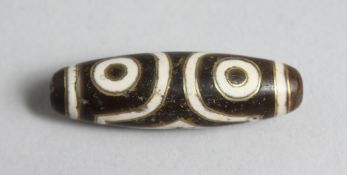 A GOLD INLAID METAL BEADS.