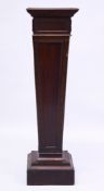 A MAHOGANY TAPERING STAND 3ft high.