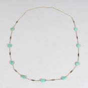 A DELICATE GEM STONE SET CHAIN.