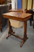 A good Victorian figured walnut worktable with rising top enclosing a fitted interior above a