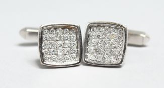A PAIR OF 18CT WHITE GOLD AND PAVE SET DIAMOND CUFF LINKS.