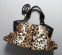 A PONY SKIN CARTIER BAG.