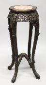 A CHINESE ROSEWOOD AND MARBLE INSET OCTAGONAL SHAPED VASE STAND, with bead carved top, pierced and