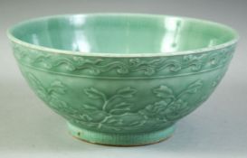 A LARGE CHINESE CELADON GLAZE PORCELAIN BOWL, with floral decoration, the inner rim with greek key