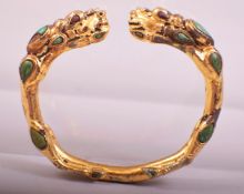 A CHINESE GILDED BRONZE BRACELET, 8cm wide.