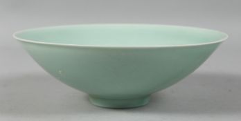 A CHINESE CELADON GLAZE BOWL, the interior with incised decoration. 21cm diameter