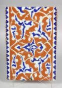 A TURKISH OTTOMAN GLAZED POTTERY TILE, 24cm x 16.5cm.