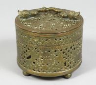 A 19TH CENTURY INDIAN BRASS OPEN WORKED BOX, depicting a British emblem, with hinged lid and handle,