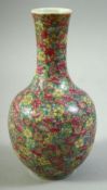 A SMALL CHINESE FAMILLE ROSE MILLEFLEUR PORCELAIN VASE, 18cm high.
