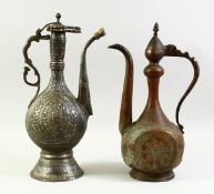 TWO ISLAMIC COPPER EWERS, each with engraved decoration. Tallest 42cm high, the other 40.5cm