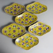 SIX CHINESE YELLOW GROUND QUATREFOIL DISHES, each decorated with circular stylised motifs. 22.5cm
