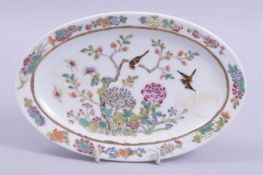 A SMALL CHINESE OVAL SHAPE DISH, painted with birds and native flora, the underside with six