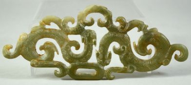 A LARGE CHINESE CARVED AND PIERCED JADE AMULET, with chilong motifs, 15cm long.