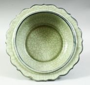 A LARGE CHINESE CELADON CRACKLE GLAZE BOWL, with petal formed rim, 21.5cm diameter.