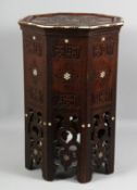 A GOOD MOORISH CARVED HARDWOOD TABLE with bone and mother-of-pearl inlay, the sides carved with