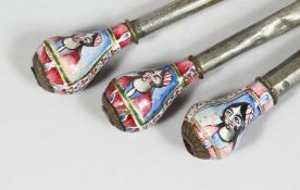 THREE 19TH CENTURY PERSIAN QAJAR ENAMELLED HUQQA MOUTH PIECES, the enamelled ends decorated with