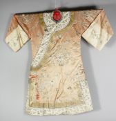 A 20TH CENTURY CHINESE EMBROIDERED SILK ROBE, finely embroidered with native flora, butterflies