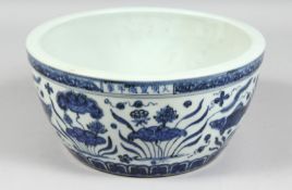 A LARGE CHINESE BLUE AND WHITE PORCELAIN BOWL, the exterior decorated with fish and algae, the rim