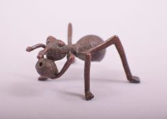 A JAPANESE BRONZE MODEL OF AN ANT, 5cm long.